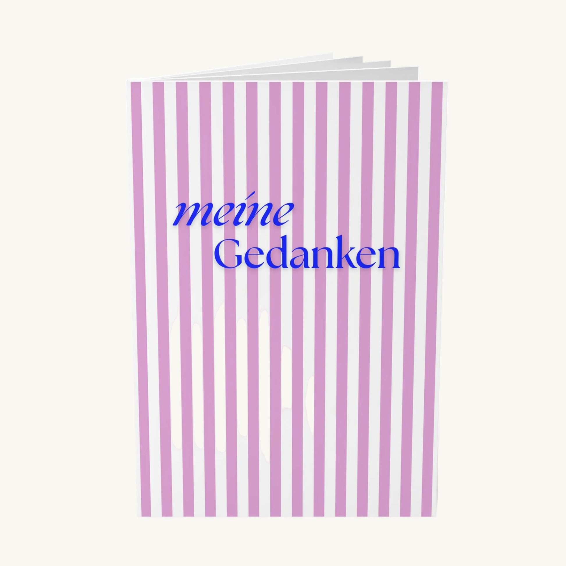 Elegantes Notizbuch mit vertikalen rosa-weißen Streifen und dem blauen Schriftzug „meine Gedanken“ in einer stilvollen Kombination aus Schreibschrift und moderner Serifenschrift.