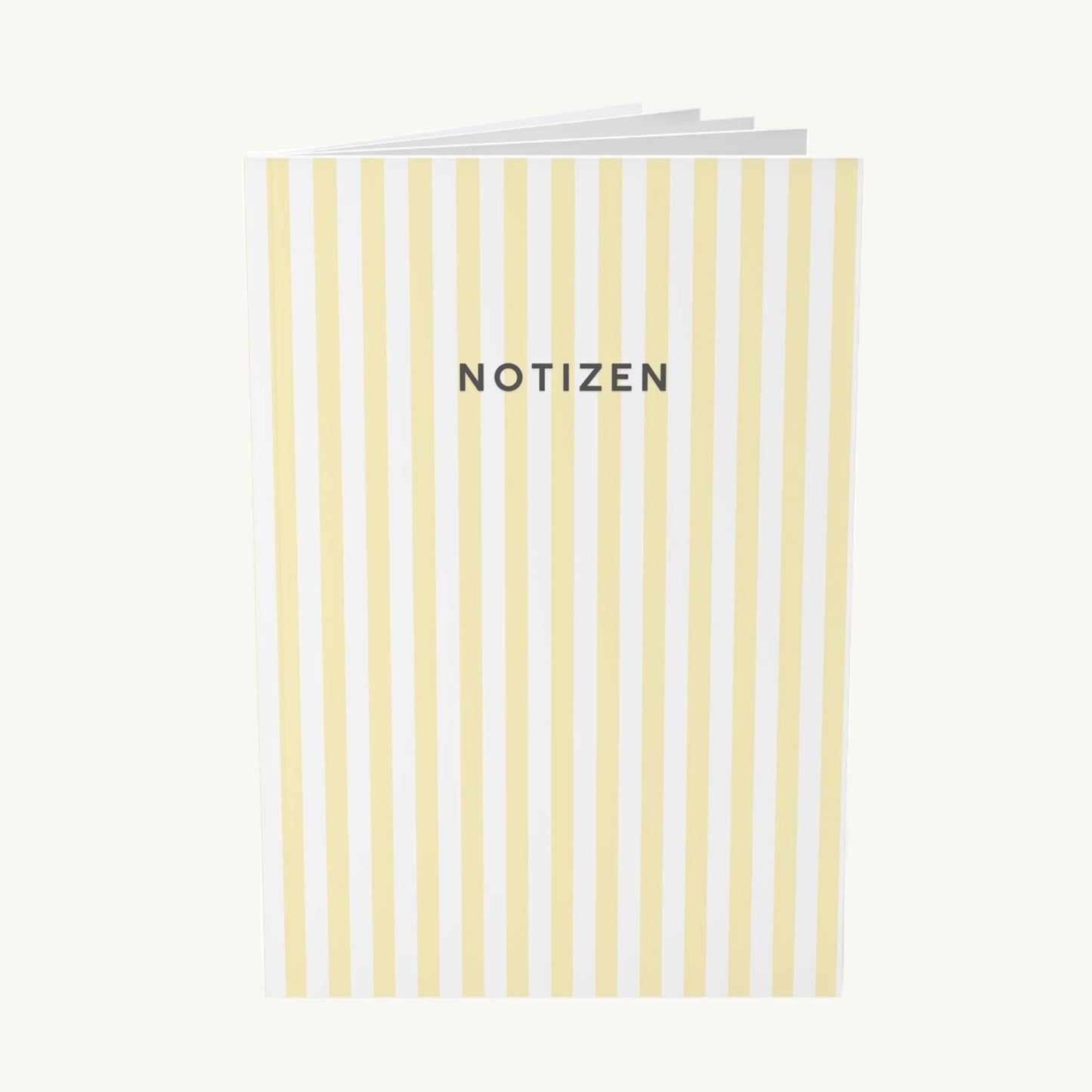  Modernes Notizbuch mit vertikalen, hellgelben Streifen und dem zentrierten, dunkelgrauen Schriftzug „NOTIZEN“ in klarer, serifenloser Schrift, ideal zur Organisation bei Brain Fog.