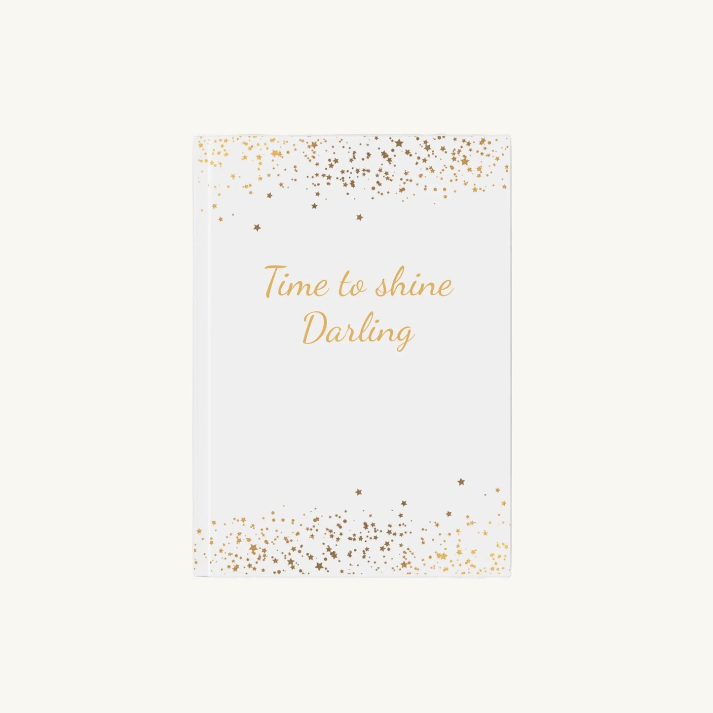 Weißes A5 Notizbuch mit der Aufschrift 'Time to shine Darling' in goldener Schrift mit kleinen goldenen Sternen für die Menopause. Das Journal ist als Begleiter für Achtsamkeit und Reflexion für Frauen in den Wechseljahren konzipiert.